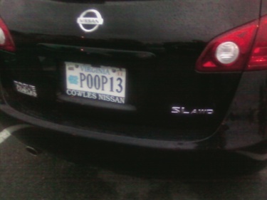 Photo of a license plate that says "POOP13"
